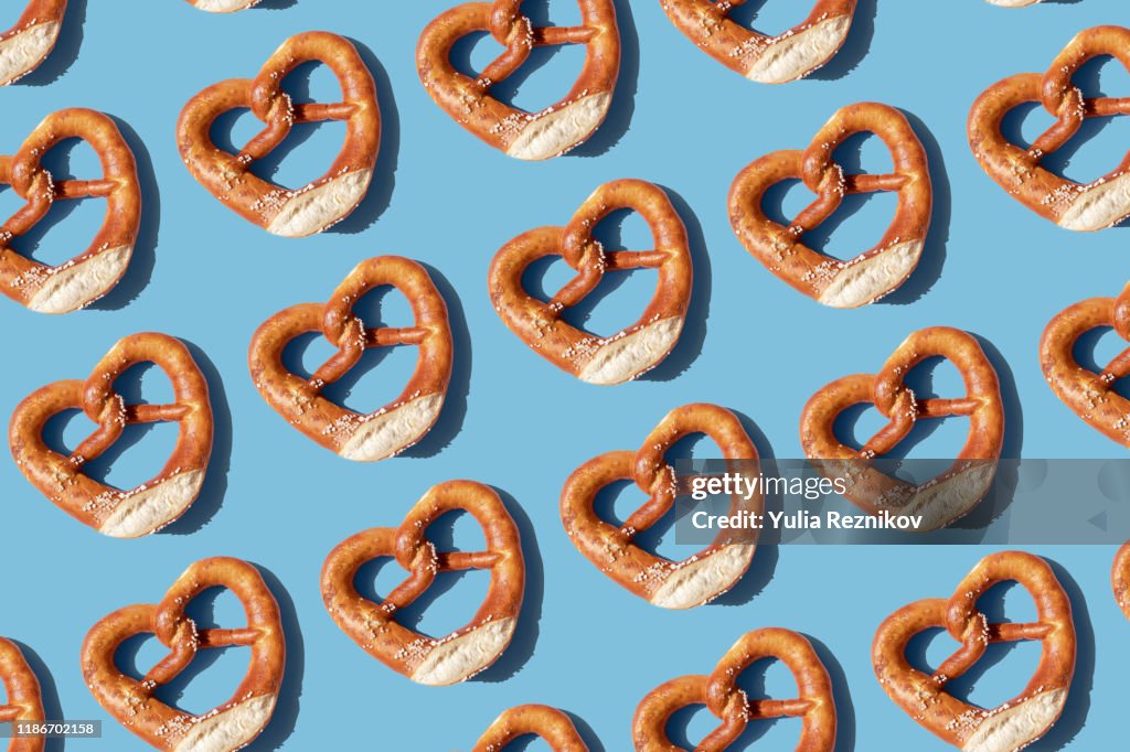 Repeated pretzels on blue background