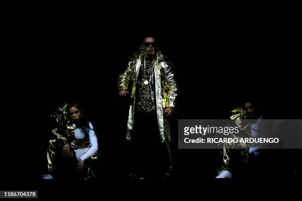 Puerto Rican reggaeton singer Daddy Yankee performs on stage during his concert at the Coliseo de Puerto Rico in San Juan, Puerto Rico on December 5,...