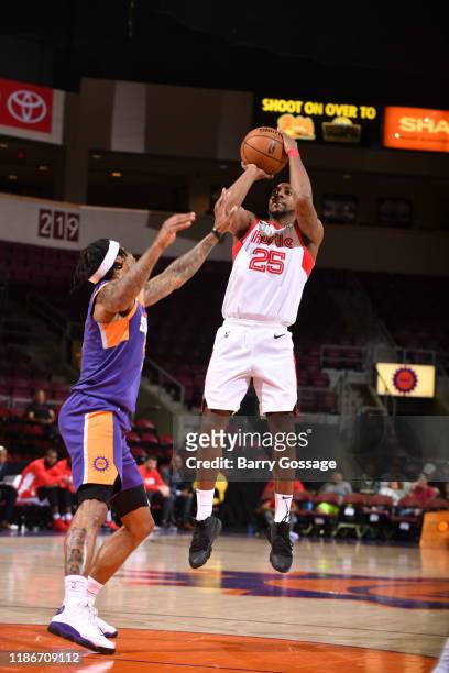 Marquis Teague of the Memphis Hustle shoots against Ahmed Hill of the Northern Arizona Suns on December 5 at the Findlay Toyota Center in Prescott...
