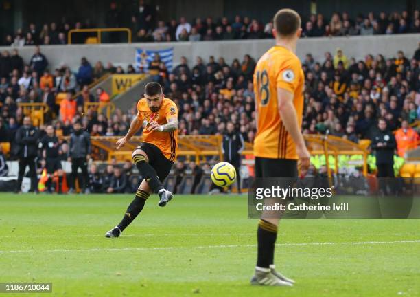 Ruben Neves of Wolverhampton Wanderers scores his team's first goal during the Premier League match between Wolverhampton Wanderers and Aston Villa...
