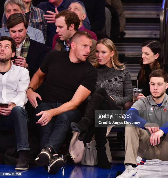 David Lee and Caroline Wozniacki attend Denver Nuggets v New York Knicks game at Madison Square Garden on December 5, 2019 in New York City.