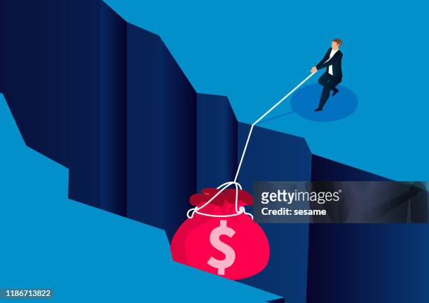 businessman pulling a money bag down the cliff - ravine stock illustrations