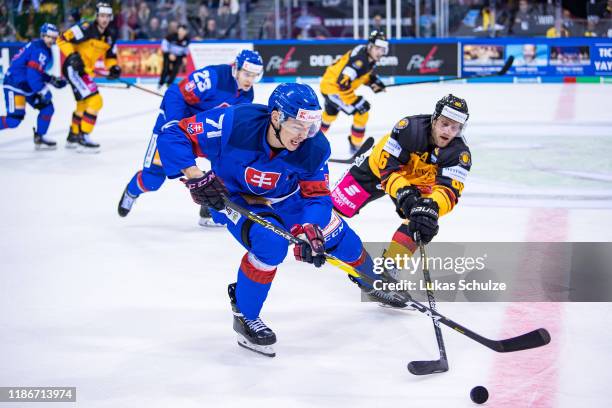 Marek Daloga of Slovakia battles for possession with Daniel Pietta of Germany during the Deutschland Cup 2019 match between Germany and Slovakia at...