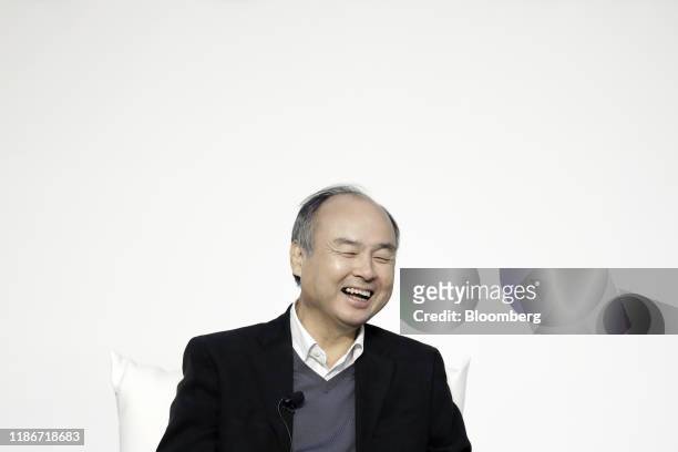 Masayoshi Son, chairman and chief executive officer of SoftBank Group Corp., reacts during a dialog session with Jack Ma, former chairman of Alibaba...