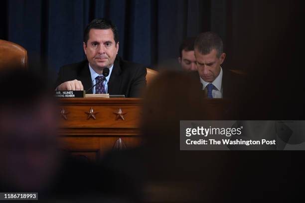 Representative Devin Nunes , left, speaks as counsel, Steve Castor is seen at right as Nunes questions Dr. Fiona Hill, former National Security...
