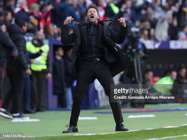 Diego Simeone, Manager of Atletico Madrid celebrates after a VAR review leads to his team's first goal being awarded during the La Liga match between...
