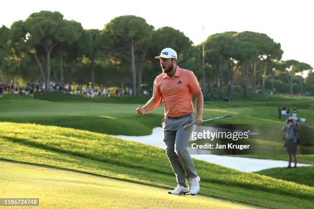 Tyrrell Hatton of England celebrates after chipping in on the eighteenth to earn a place in the playoff during Day Four of the Turkish Airlines Open...
