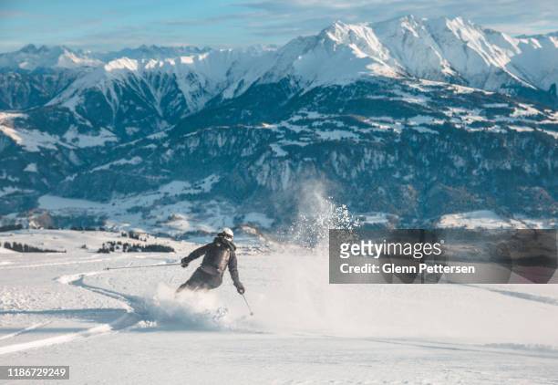 woman skiing in laax, switzerland. - skiing stock pictures, royalty-free photos & images