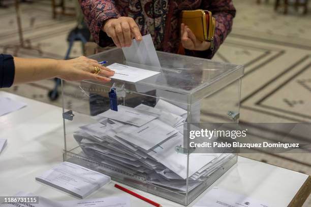 Woman casts her vote at a polling station during the Spanish General Elections on November 10, 2019 in Madrid, Spain. Spain holds its fourth general...