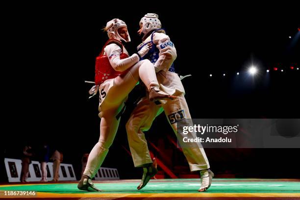 Nur Tatar Askari of Turkey competes with Yulia Zaitseva of Russia during the 2019 World Taekwondo Grand Prix final qualification in 67kg, in Moscow,...