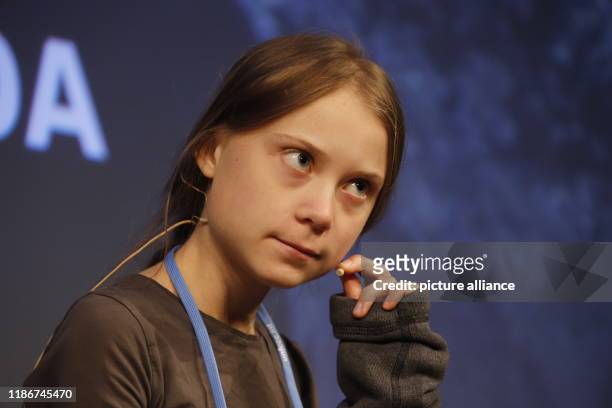 December 2019, Spain, Madrid: Greta Thunberg, climate activist from Sweden, talks to other young activists at a press conference. Thunberg is to give...
