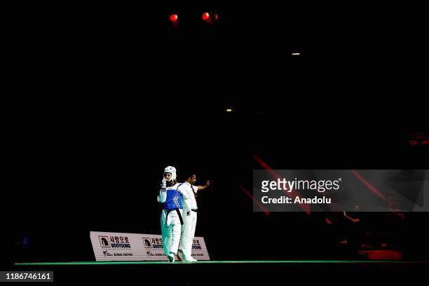 Rukiye Yildirim of Turkey competes with Jingyu Wu of China during the 2019 World Taekwondo Grand Prix final qualification in 49kg, in Moscow, Russia...