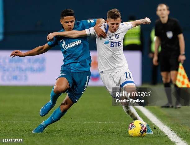 Douglas Santos of FC Zenit Saint Petersburg and Sebastian Szymanski of FC Dynamo Moscow vie for the ball during the Russian Premier League match...
