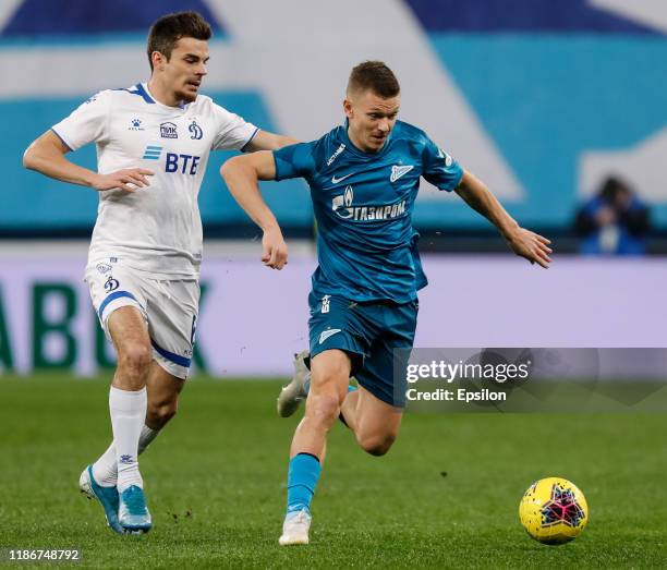 Oleg Shatov of FC Zenit Saint Petersburg and Artur Yusupov of FC Dynamo Moscow vie for the ball during the Russian Premier League match between FC...