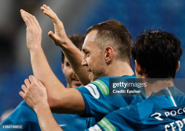 Artem Dzyuba of FC Zenit Saint Petersburg celebrates his goal with teammates during the Russian Premier League match between FC Zenit Saint...