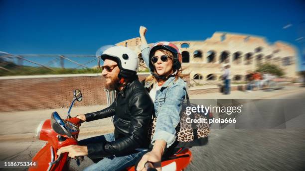 selfie scooter riding: on the motorbike by the coliseum - driving italy stock pictures, royalty-free photos & images