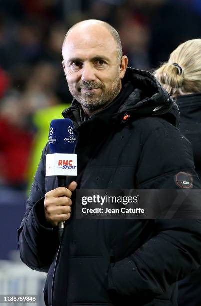 Christophe Dugarry of RMC Sport comments the UEFA Champions League group G match between Olympique Lyonnais and SL Benfica at Groupama Stadium on...