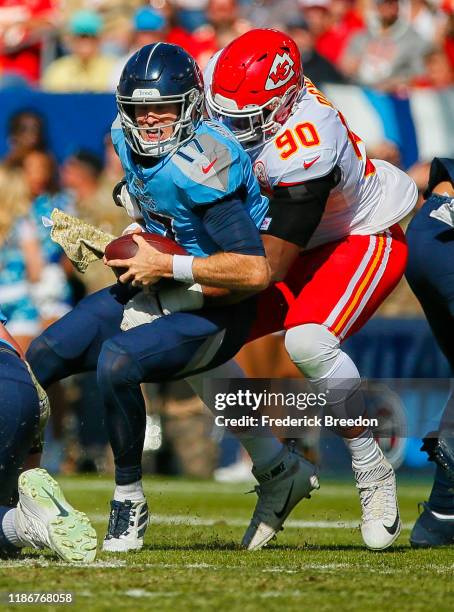 Emmanuel Ogbah of the Kansas City Chiefs sacks quarterback Ryan Tannehill of the Tennessee Titans during the first half at Nissan Stadium on November...