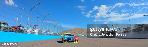 Kyle Busch, driver of the M&M's Toyota, leads the field to the green flag at the satrt of the Monster Energy NASCAR Cup Series Bluegreen Vacations...