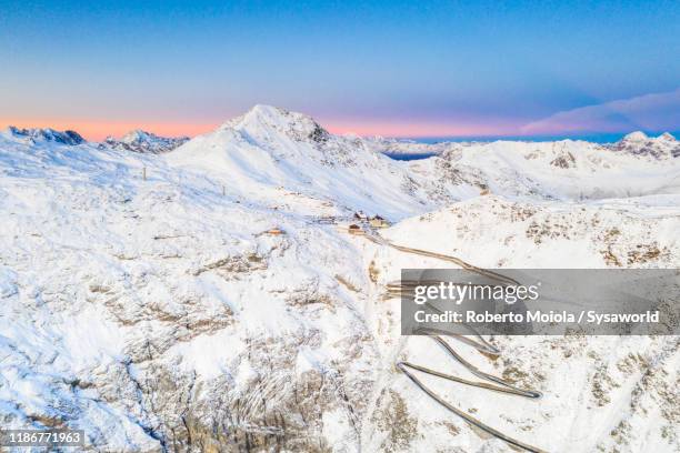 snow on stelvio pass mountain road, aerial view, bormio, lombardy, italy - bormio stock pictures, royalty-free photos & images