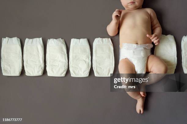 baby with diapers - diaper stock pictures, royalty-free photos & images