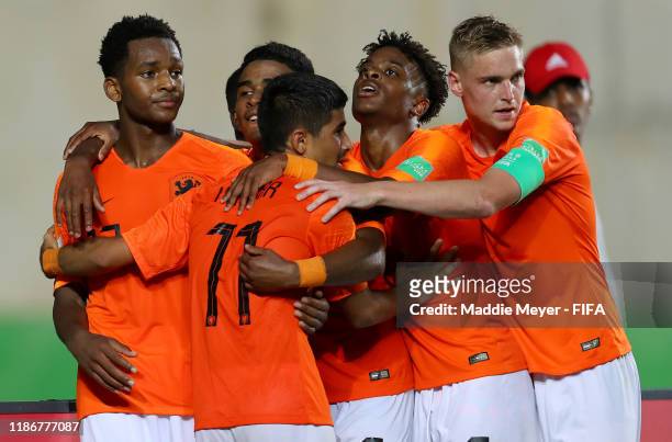 Jayden Braaf of Netherlands celebrates the third goal for his team with his teammates during the quarterfinal match between Netherlands and Paraguay...