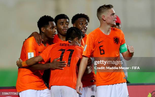 Jayden Braaf of Netherlands celebrates the third goal for his team with his teammates during the quarterfinal match between Netherlands and Paraguay...