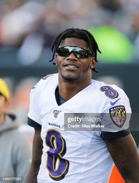 Lamar Jackson of the Baltimore Ravens wears sunglasses on the sideline during the fourth quarter of the game against the Cincinnati Bengals at Paul...