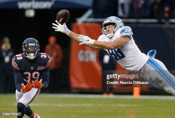 Hockenson of the Detroit Lions is unable to make a catch in front of Eddie Jackson of the Chicago Bears during the second half at Soldier Field on...