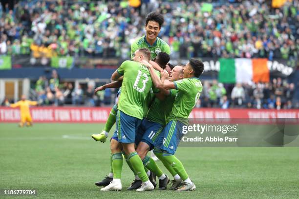 The Seattle Sounders celebrate a goal by Kelvin Leerdam of the Seattle Sounders to take a 1-0 lead against Toronto FC in the second half during the...