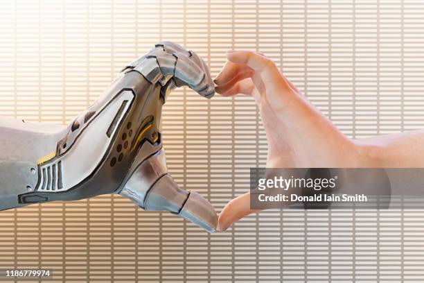 robot heart shaped hand: futuristic dating concept - robotic heart stock-fotos und bilder