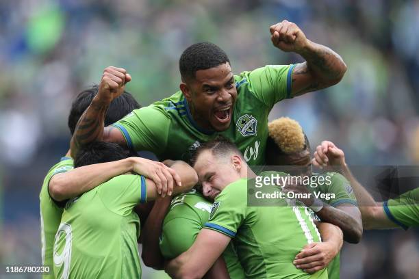 Roman Torres of Seattle Sounders FC celebrates the 1st goal with his teammates during the match between Toronto FC and Seattle Sounders as part of...