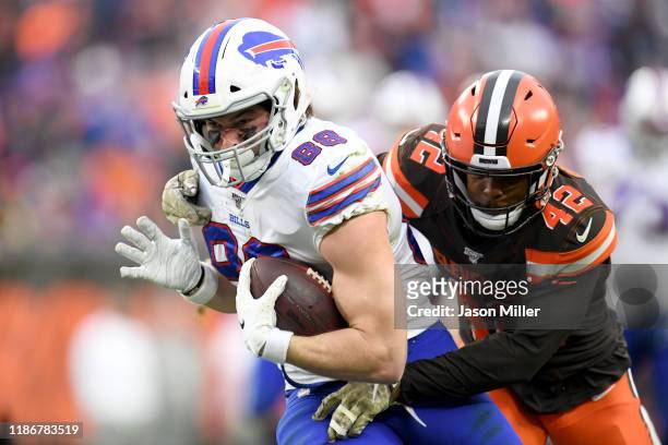 Tight end Dawson Knox of the Buffalo Bills is tackled by strong safety Morgan Burnett of the Cleveland Browns during the second half at FirstEnergy...