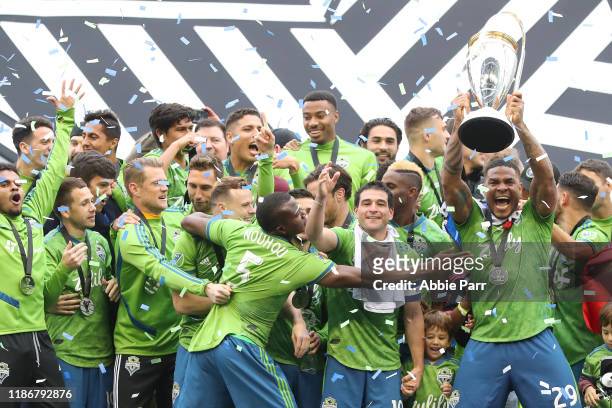 The Seattle Sounders celebrate after defeating Toronto FC 3-1 to win the 2019 MLS Cup at CenturyLink Field on November 10, 2019 in Seattle,...