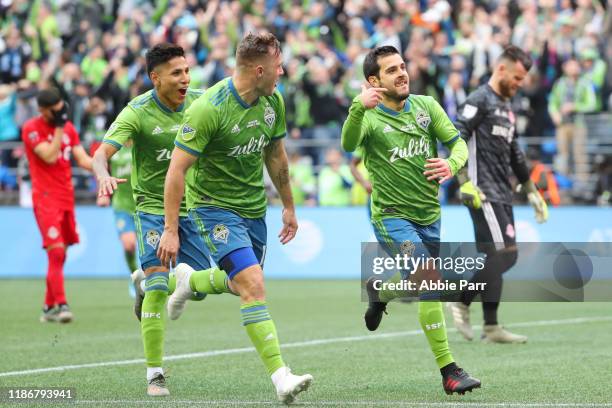 Victor Rodriguez of the Seattle Sounders celebrates with teammates after scoring a goal in the second half to give the Seattle Sounders a 2-0 lead...