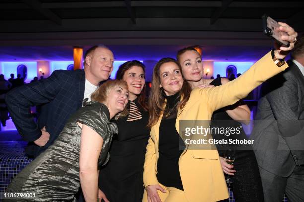 Gesine Cukrowski, Simon Schwarz, Katharina Wackernagel, Rebecca Immanuel and Lisa Maria Potthoff take a selfie during the ARD advent dinner hosted by...