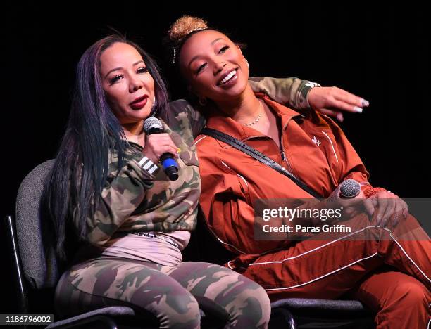 Tameka "Tiny" Harris and Zonnique Pullins speak onstage during 2019 Atlanta Ultimate Women's Expo at Cobb Galleria Centre on November 10, 2019 in...