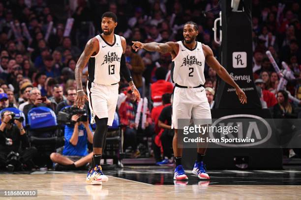 Los Angeles Clippers Guard Paul George and Los Angeles Clippers Forward Kawhi Leonard on defense during a NBA game between the Washington Wizards and...