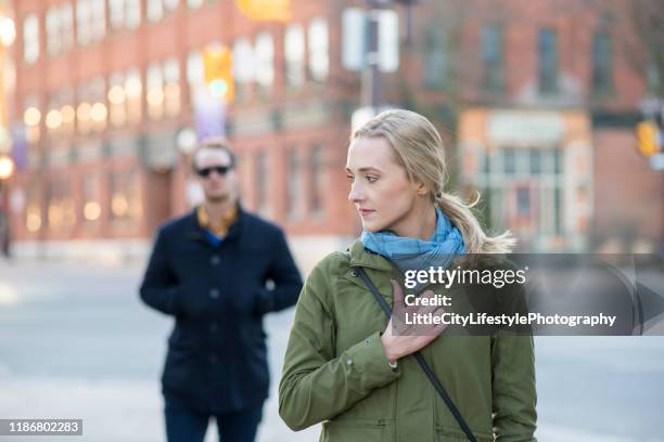 feeling unsafe when walking - stalker person stock pictures, royalty-free photos & images