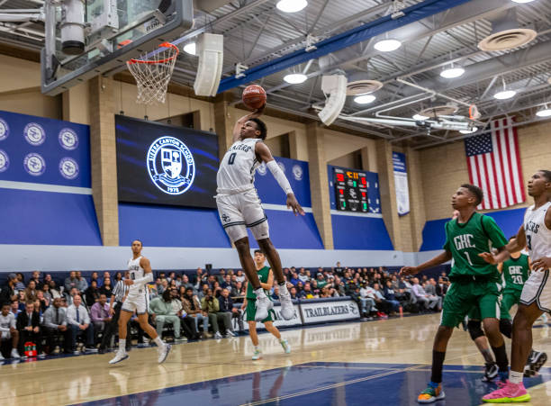 Bronny James, a freshman, dunks the ball during Sierra Canyons home opener game on Tuesday, December 3, 2019. The team, starring the sons of NBA...