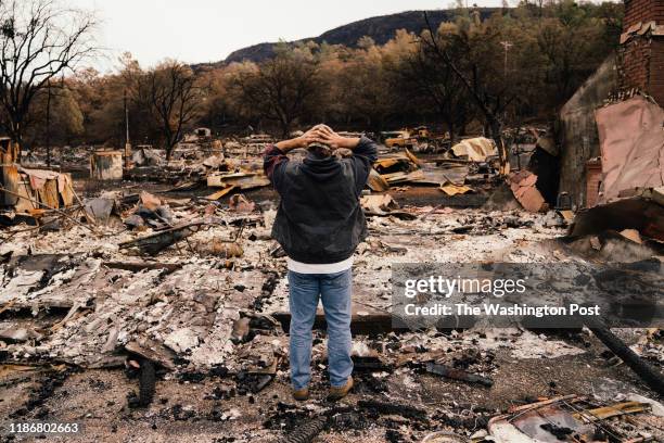 Kevin Ciotta looks over the burned out community center at the Butte Creek Mobile Home Park in Chico, California on Monday, November 26, 2018.