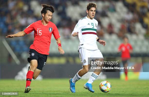 Woojin Bang of Korea Republic in action against Santiago Munoz of Mexico during the quarterfinal match between Korea Republic and Mexico in the FIFA...