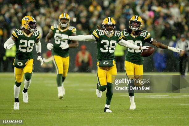 Tramon Williams of the Green Bay Packers celebrates with his teammates after an interception against Kyle Allen of the Carolina Panthers during the...