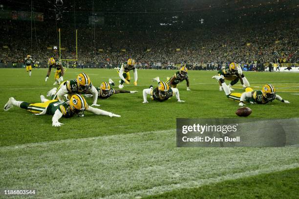 Tramon Williams of the Green Bay Packers celebrates with his teammates after an interception against Kyle Allen of the Carolina Panthers during the...