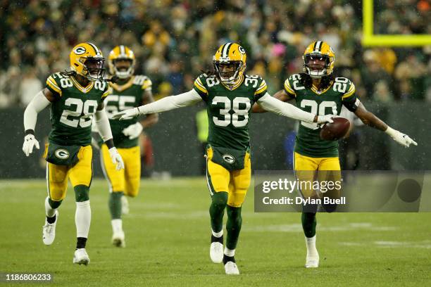 Tramon Williams of the Green Bay Packers celebrates with his teammates after an interception against Kyle Allen of the Carolina Panthers during the...