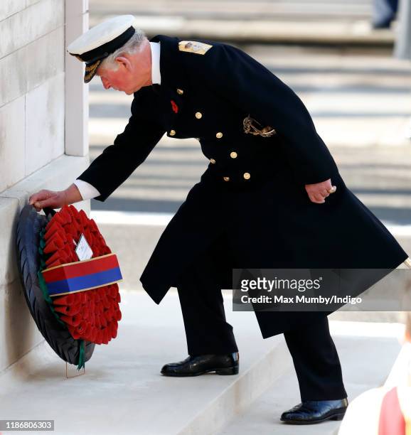 Prince Charles, Prince of Wales lays a wreath on behalf of Queen Elizabeth II during the annual Remembrance Sunday service at The Cenotaph on...