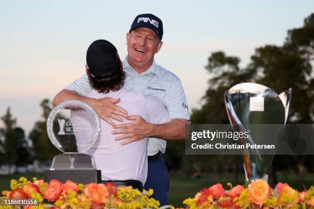 Winner of the Charles Schwab Cup, Scott McCarron and winner of the Charles Schwab Cup Championship, Jeff Maggert hug following the final round at...