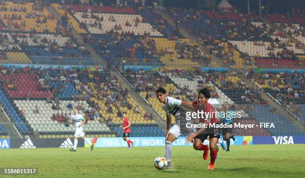 Jose Ruiz of Mexico in action against Ryunseong Kim of Korea Republic during the quarterfinal match between Korea Republic and Mexico in the FIFA...