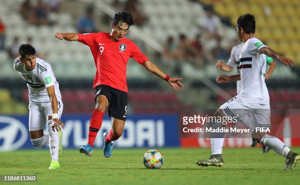 Minseo Choi of Korea Republic in action against Alejandro Gomez of Mexico during the quarterfinal match between Korea Republic and Mexico in the FIFA...