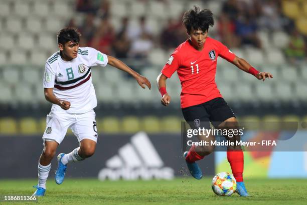 Josue Martinez of Mexico in action against Sangbin Jeong of Korea Republic during the quarterfinal match between Korea Republic and Mexico in the...